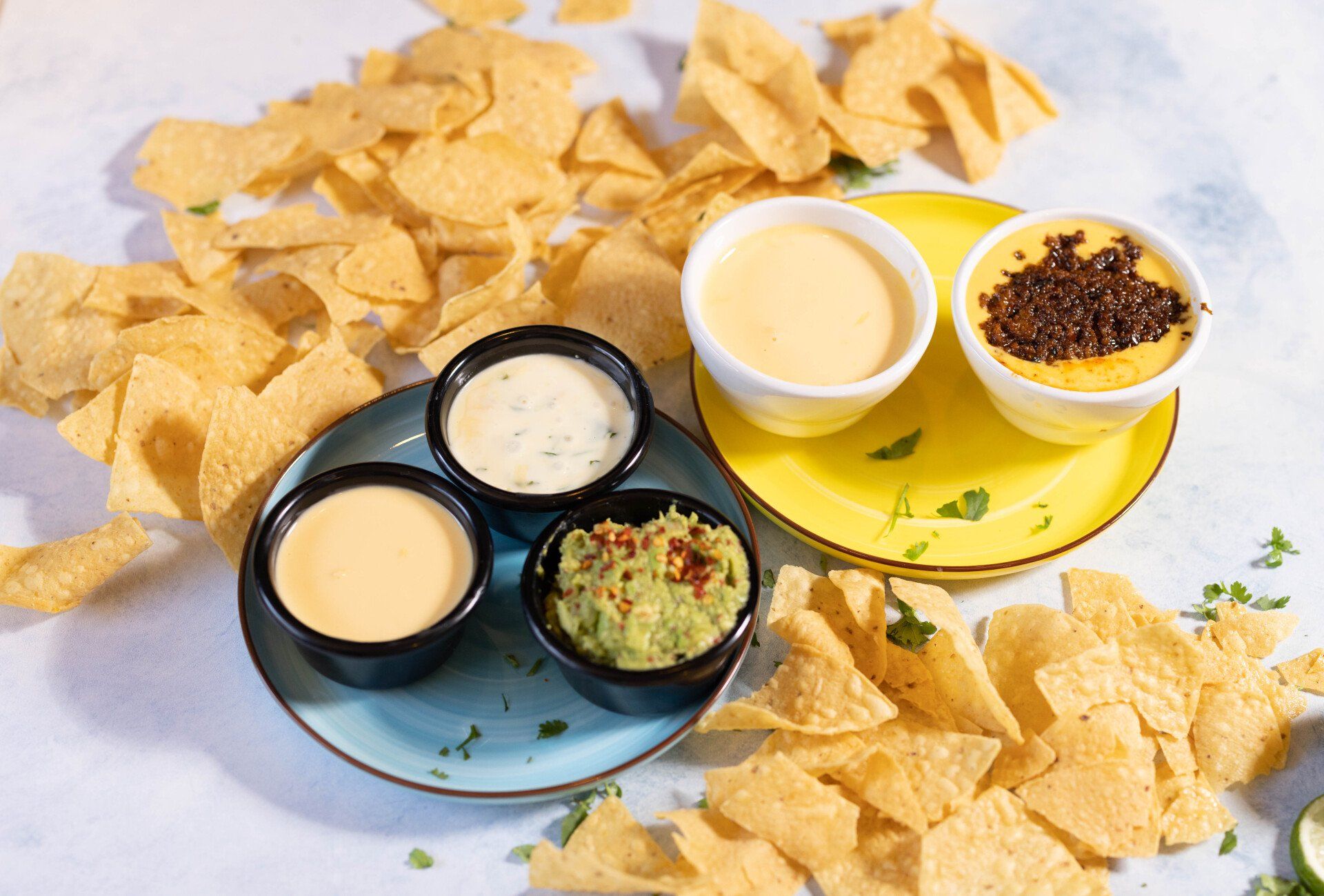 Cheese dips, Espinaca dip and guacamole small trio dip and full size cheese dips one with chorizo on top