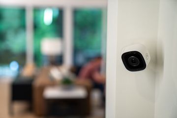 Biometric access control system with fingerprint scanners and keypad mounted on a wall.