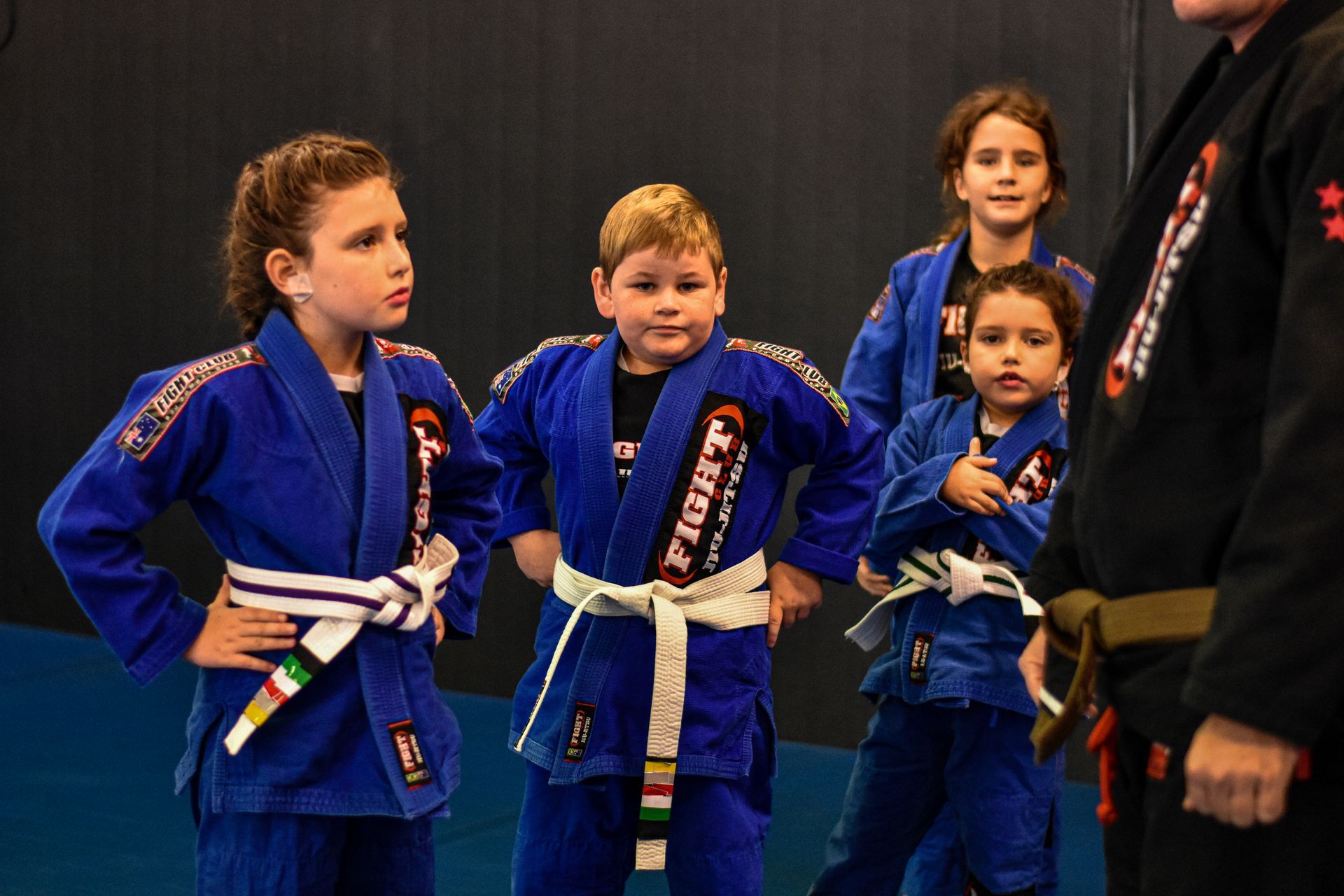 Young Lady and male lookingup to Trainor — Brazilian Jiu-Jitsu Classes in Townsville, QLD