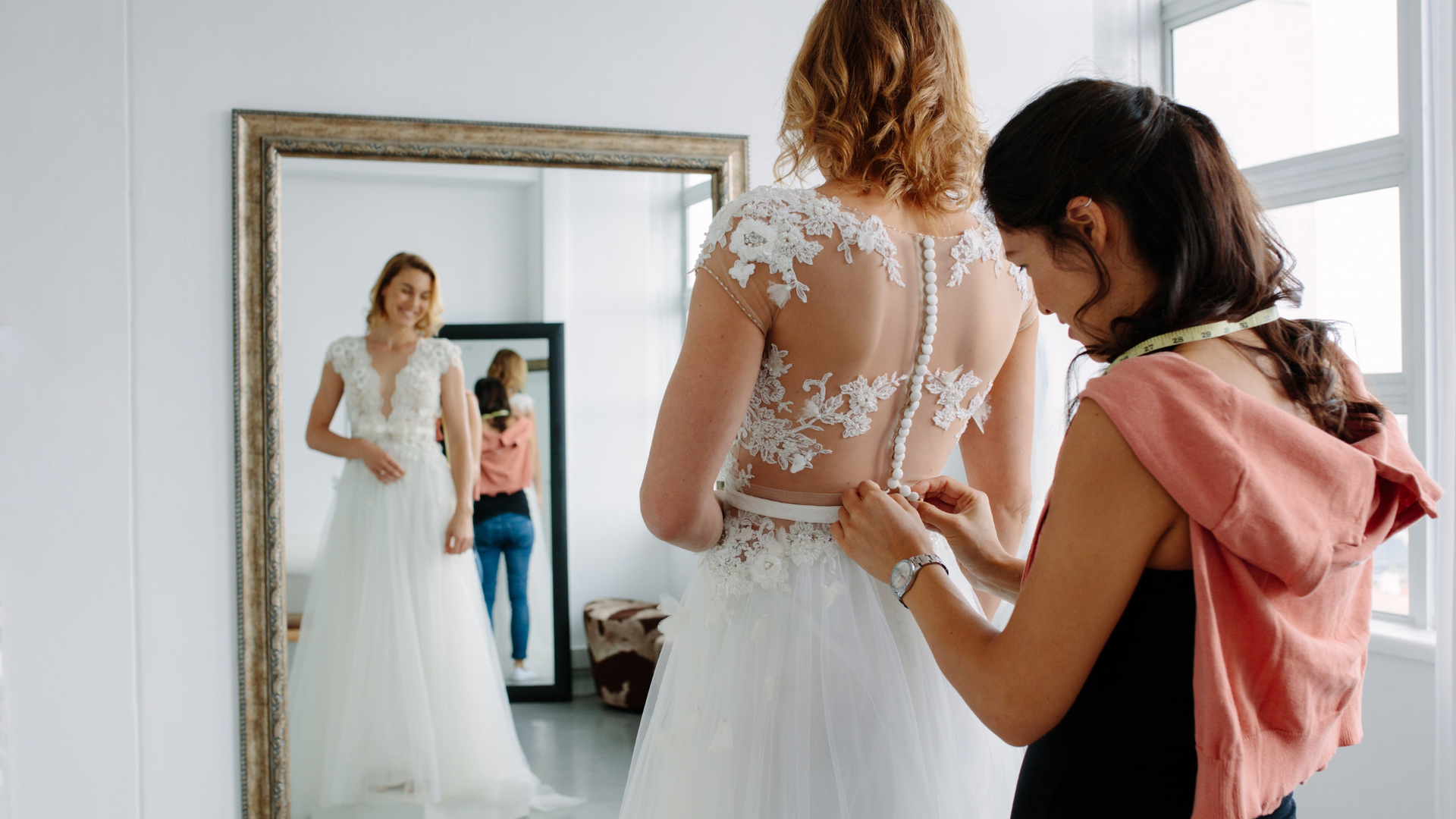 Bride exploring wedding dresses in a BridalLive-managed boutique.