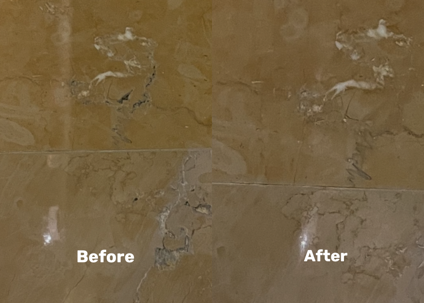 Custom matched polyurea filling tripping hazard holes in stone flooring at a casino.