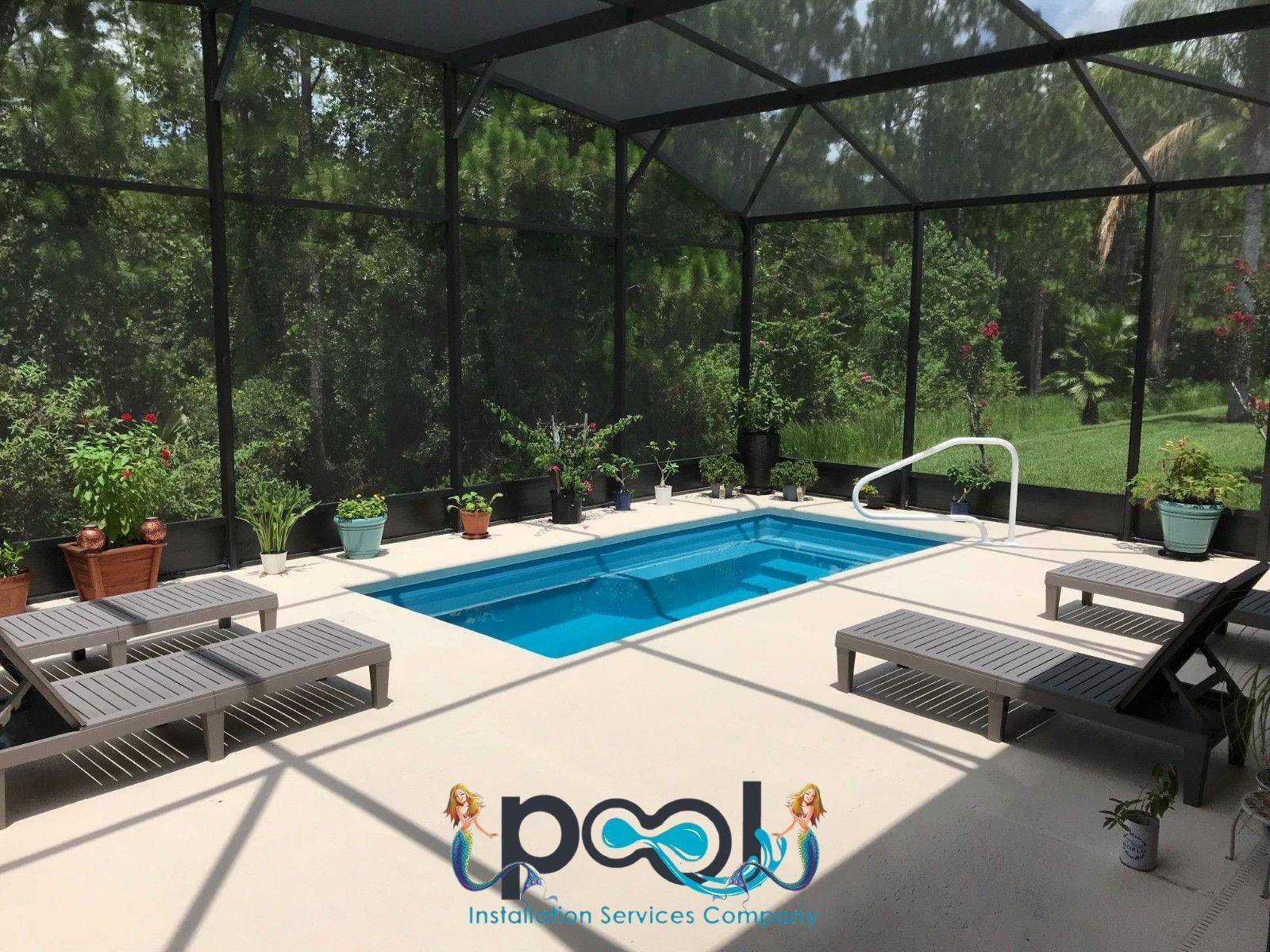 Woman in straw hat smiles, holding wine glass near a lake.