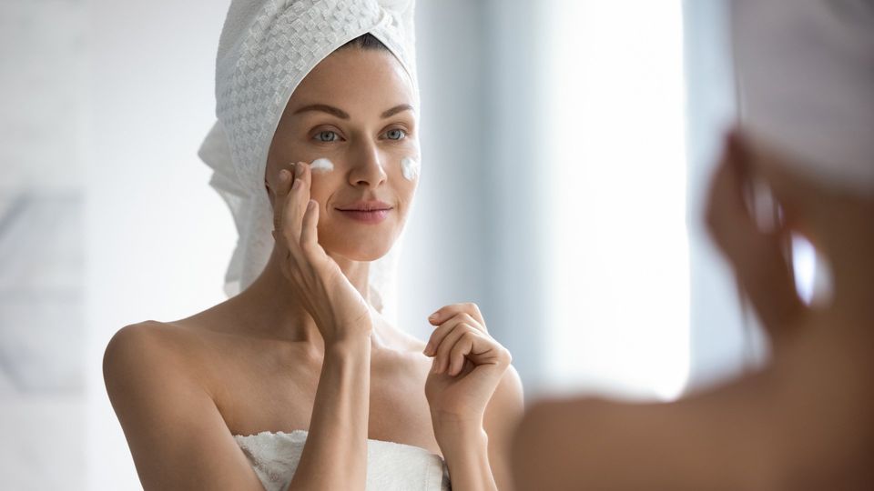 Woman Applying Facial Cream — Saginaw, MI — Barry, Ronald C MD