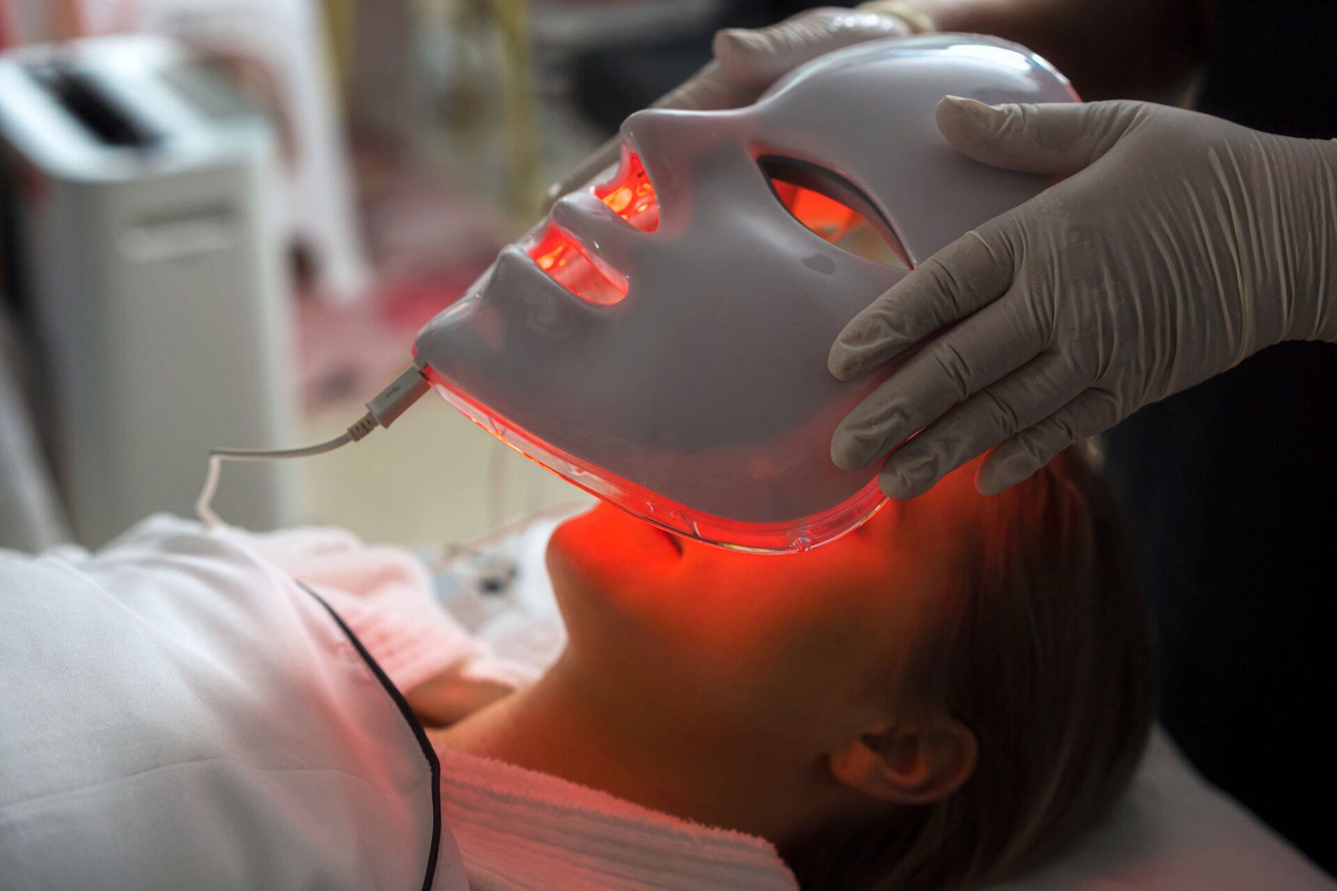Woman Getting LED Mask Regenerative Treatment — Saginaw, MI — Barry, Ronald C MD