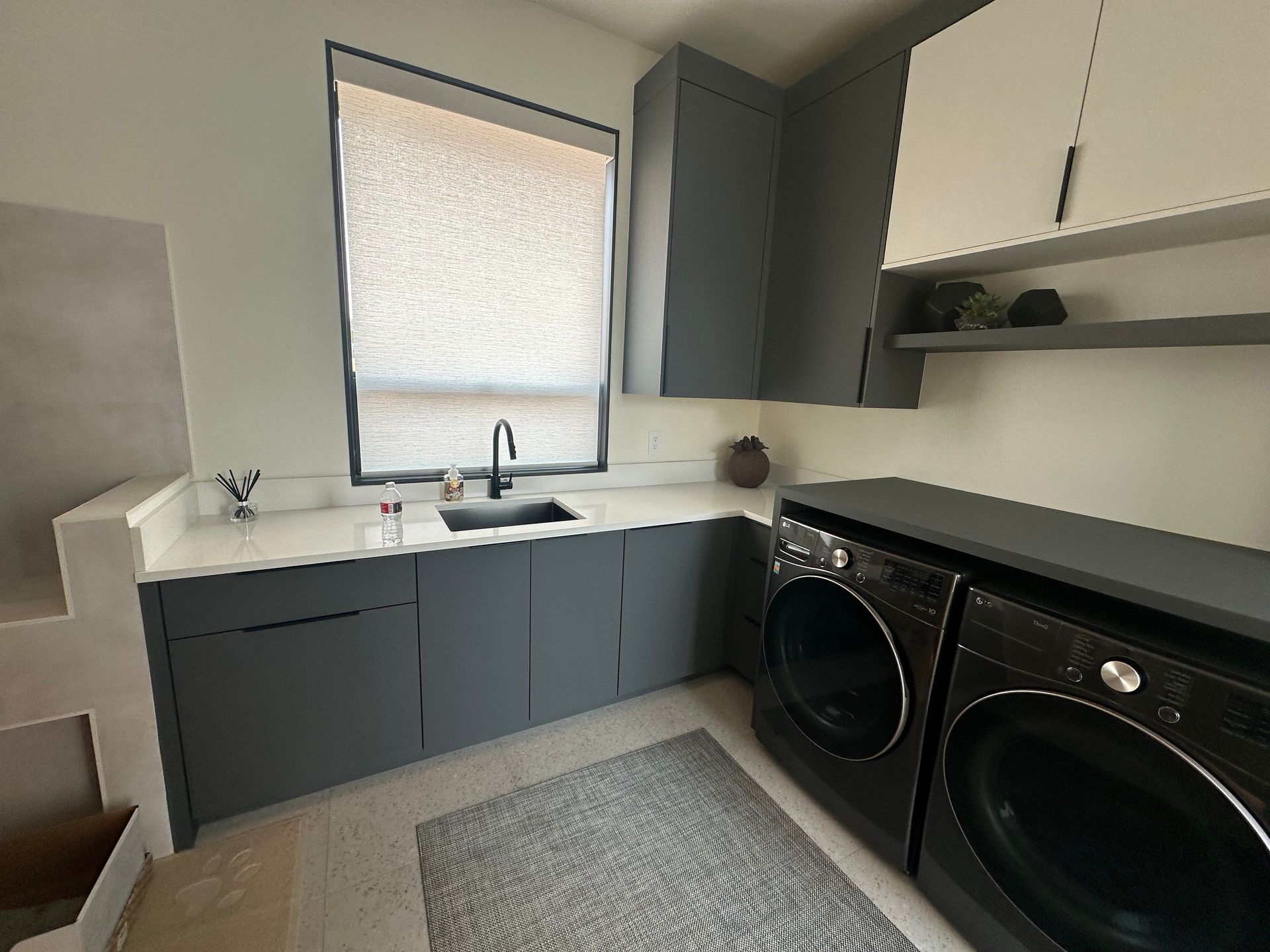 Laundry room cabinetry in modern two-tone finish — built by Pro-Tech Woodworking, Portland