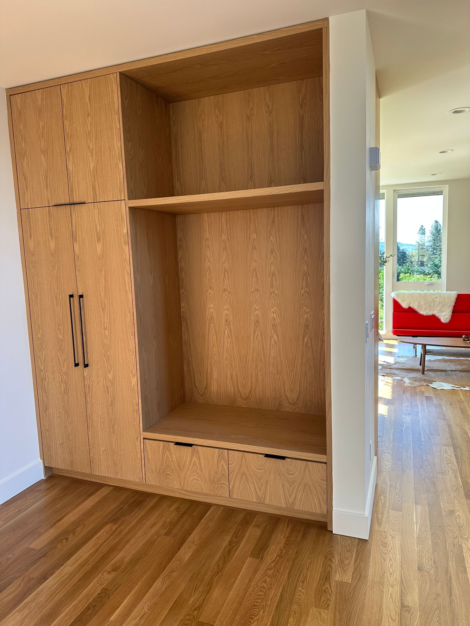 Custom oak laundry cabinet with open shelving — Pro-Tech Woodworking, Portland OR