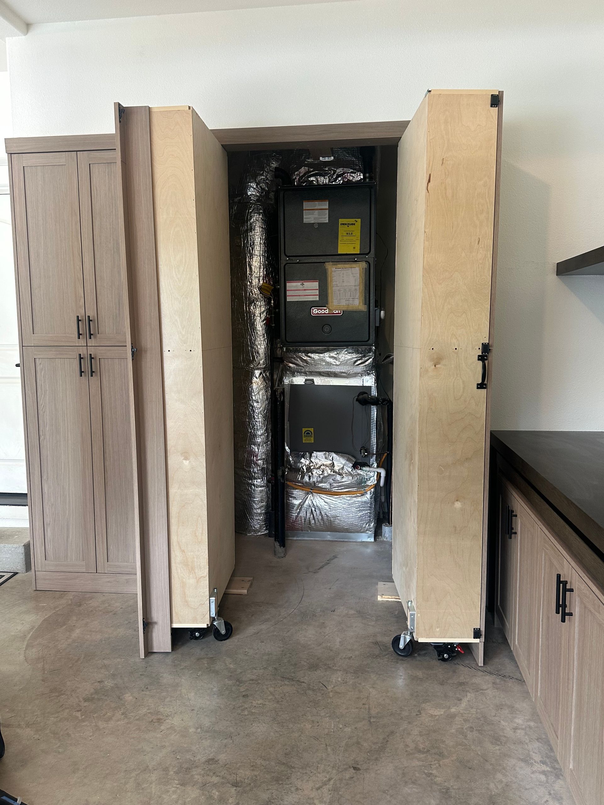 Mudroom utility cabinet and service panel enclosure — custom solution by Pro-Tech Woodworking (Portland)