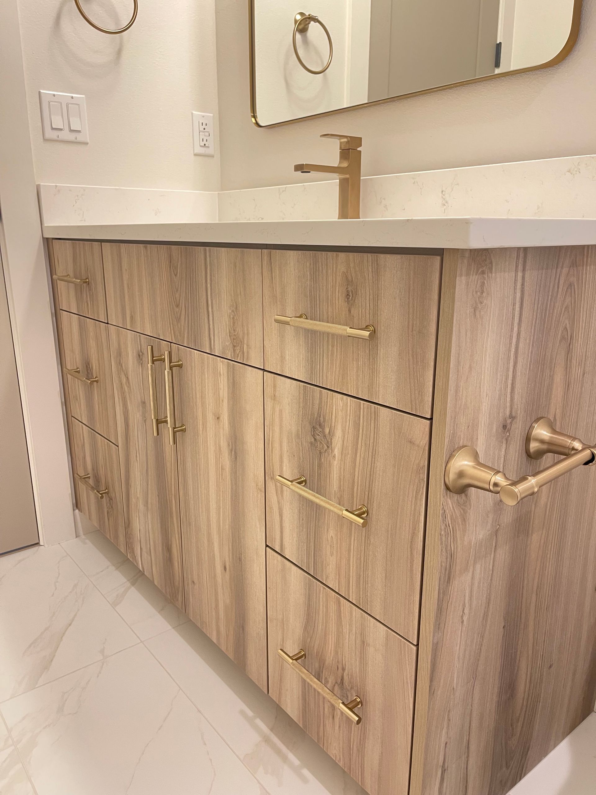 Oak bathroom vanity with gold hardware in Portland