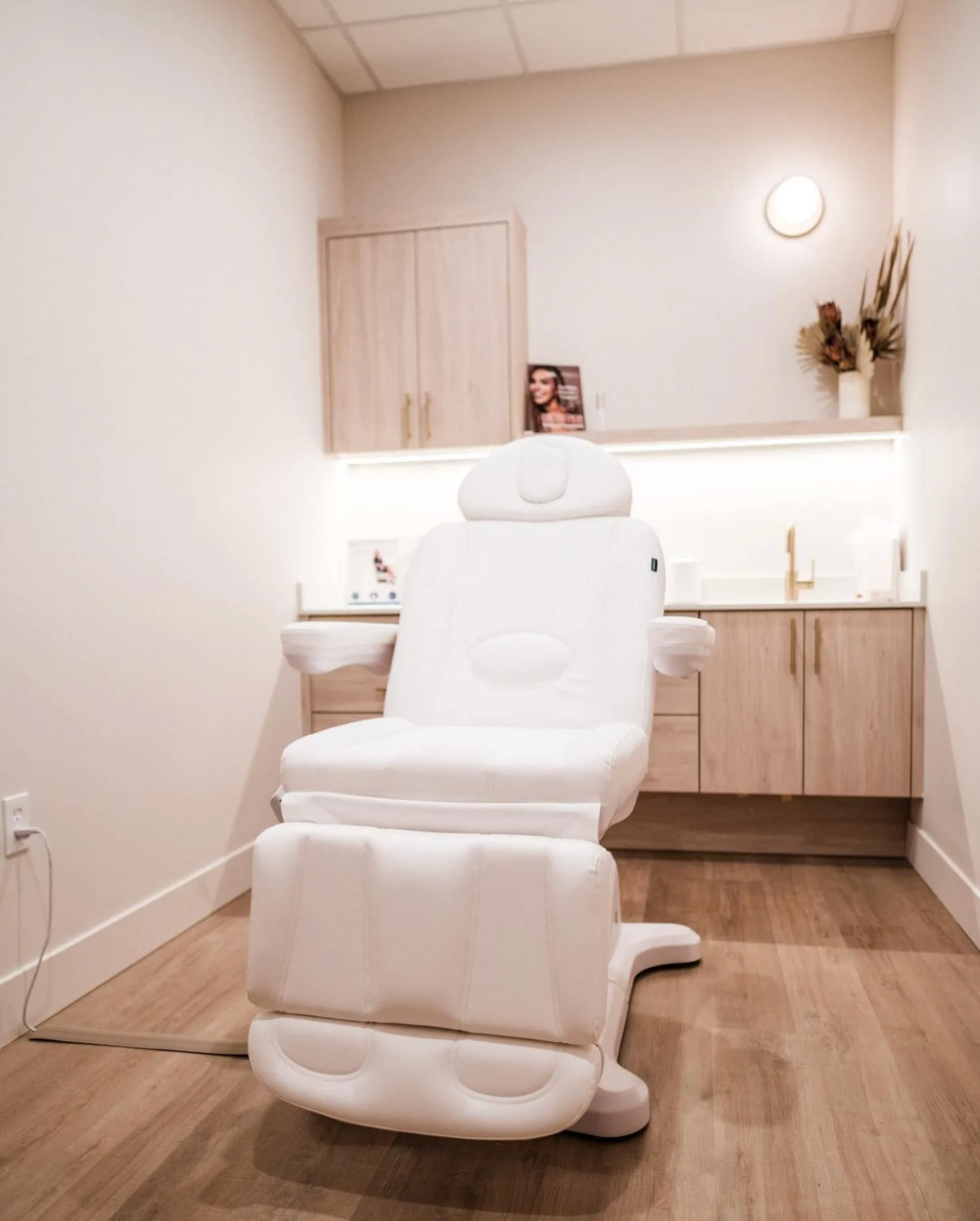 Built-in light wood cabinetry in spa or facial treatment room