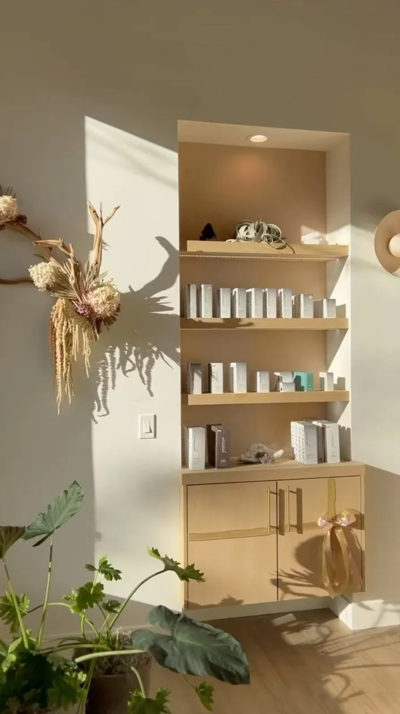 Wall shelving for product display in commercial wellness or spa space