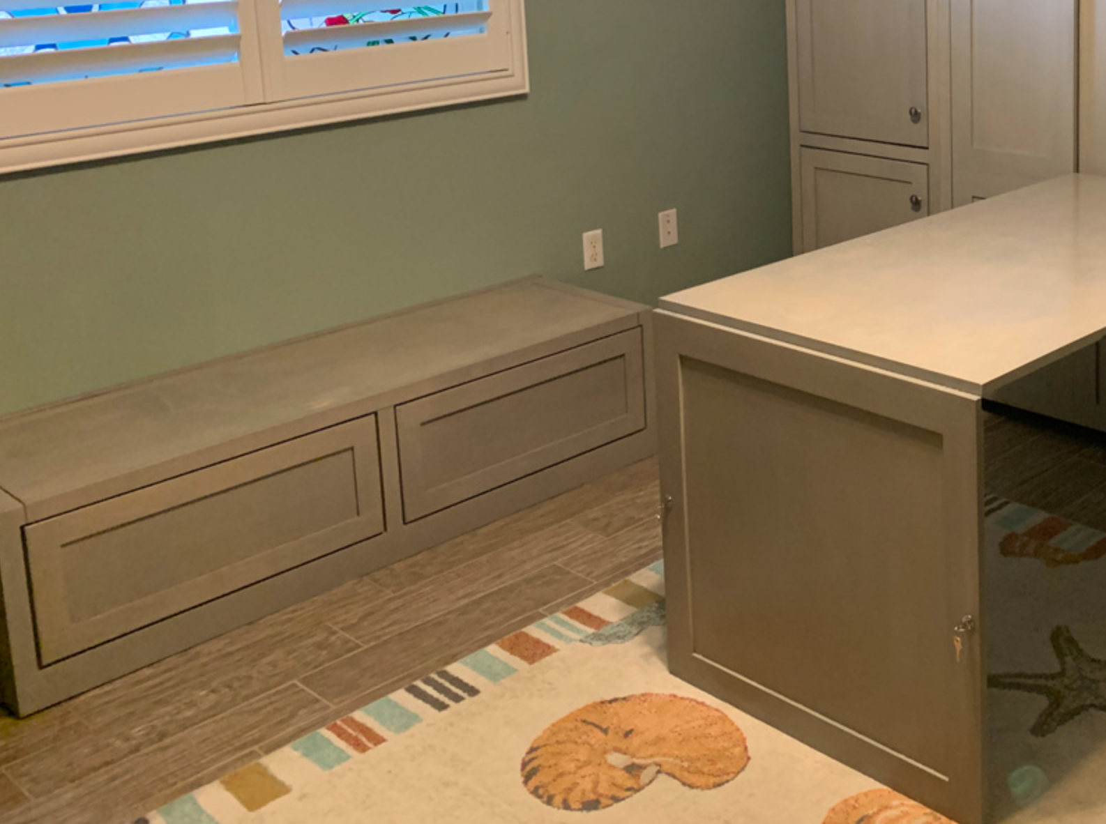 Built-in window bench with storage drawers and painted wood finish in Portland by Pro-Tech Woodworking