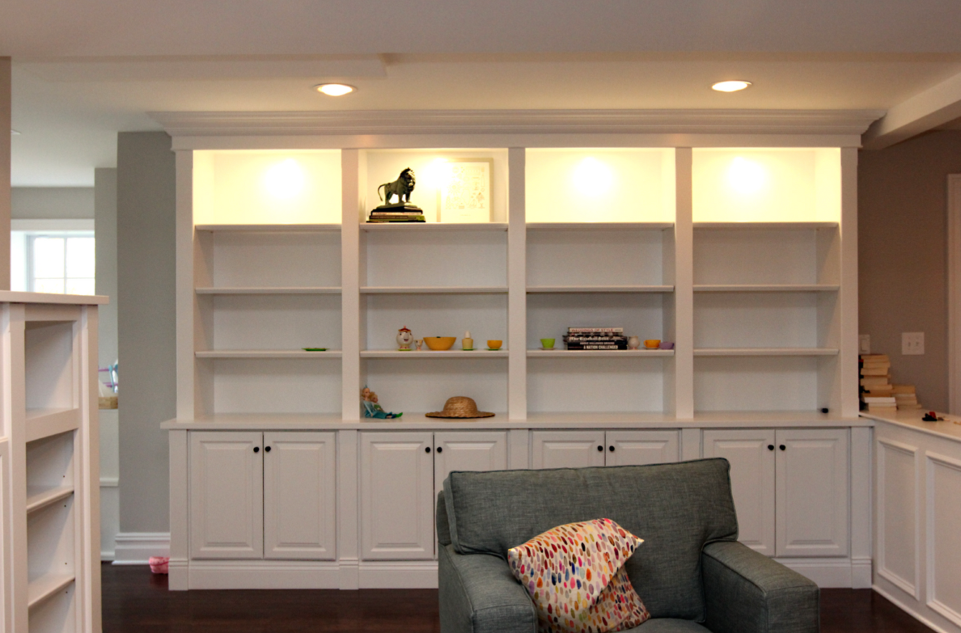 Traditional white bookcase with base cabinets and display shelves