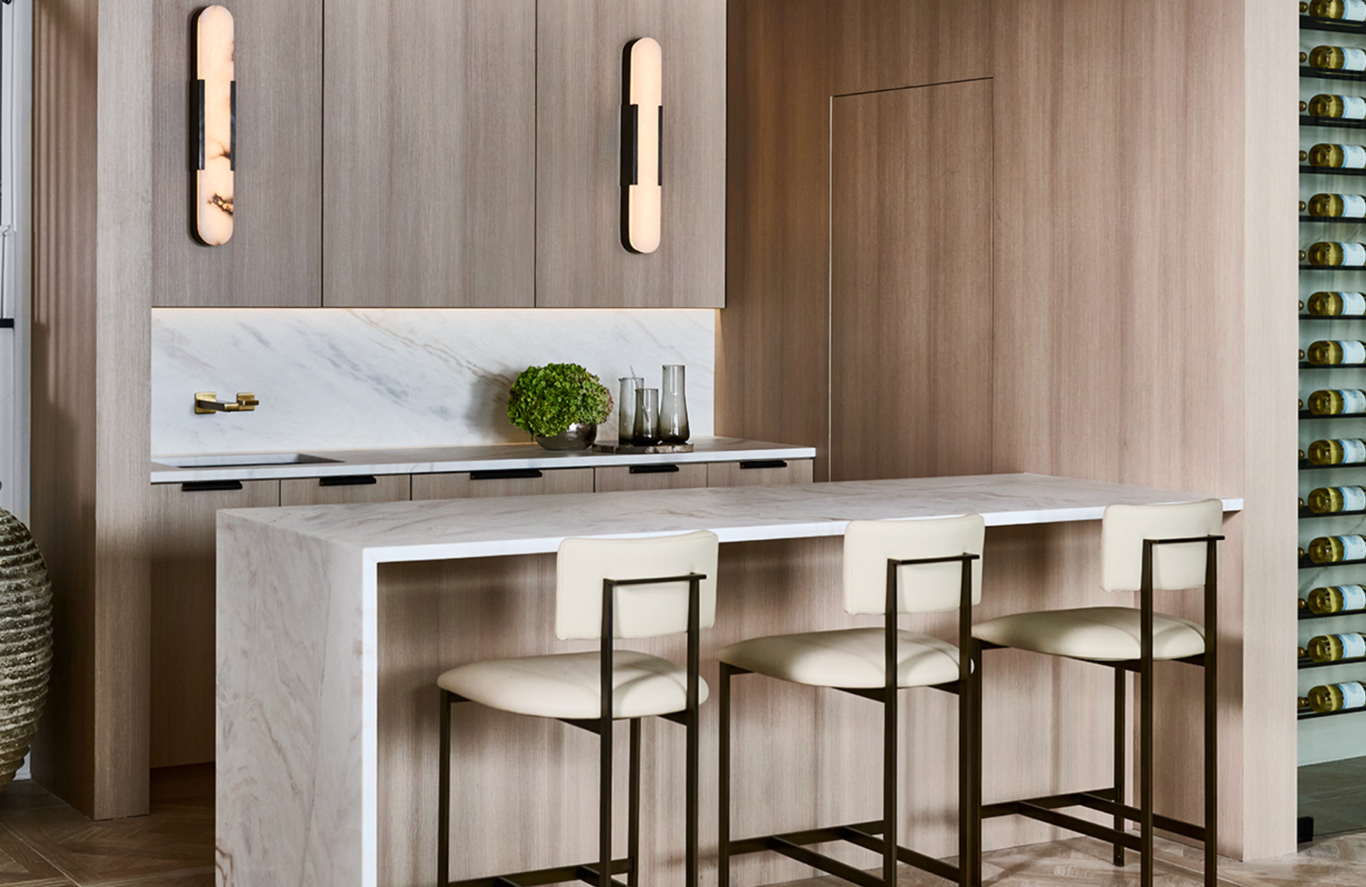 Modern kitchen with island and cabinets, illustrating wood and veneer cabinet door materials