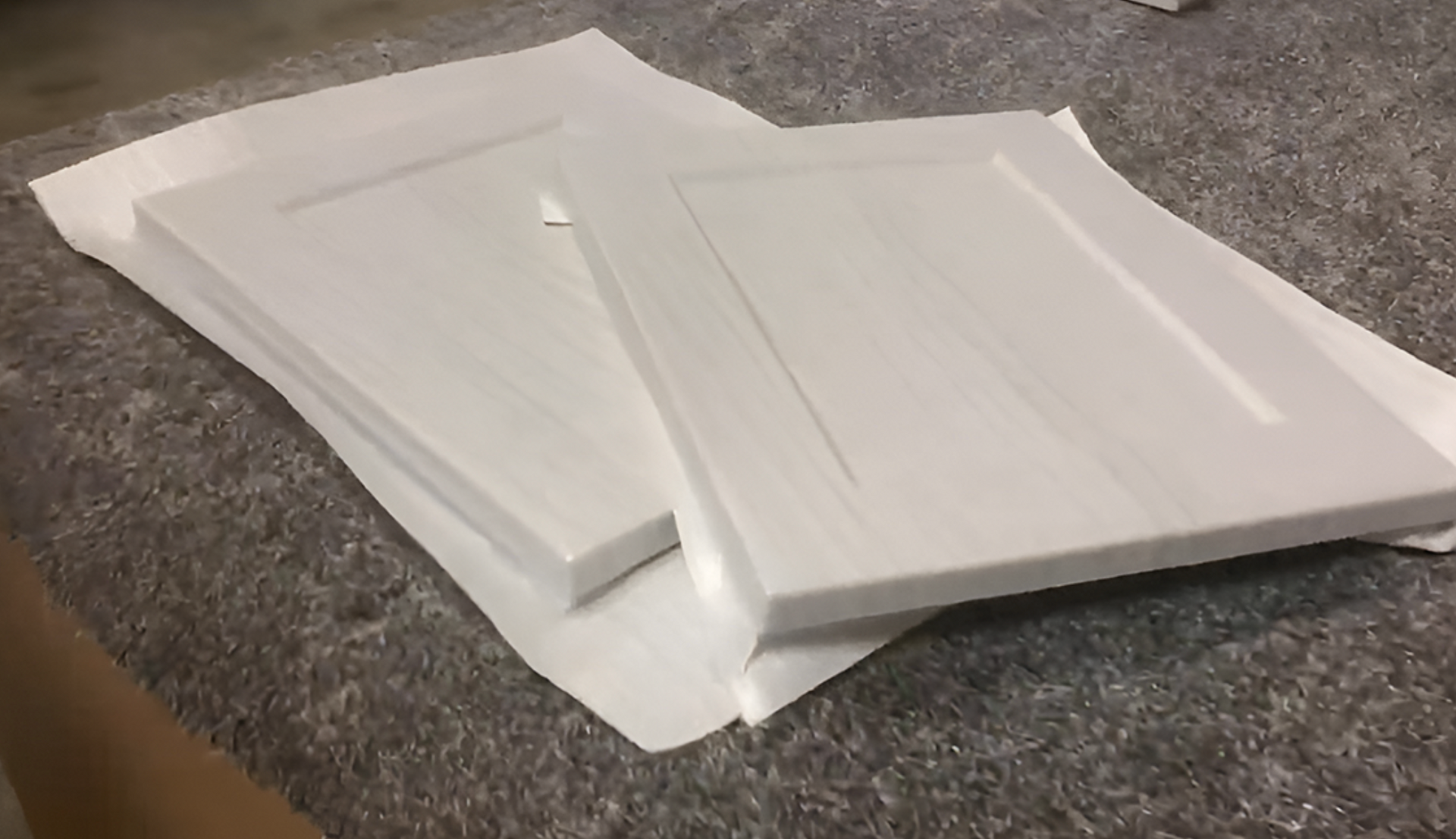 TFL cabinet samples showing laminated particleboard — Portland Pro-Tech Woodworking material display