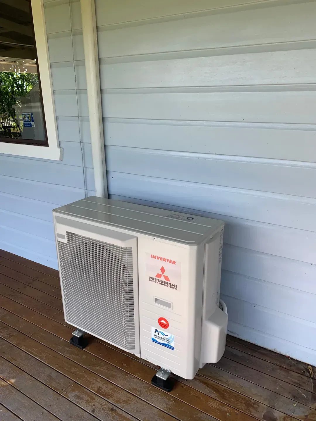 Mitsubishi Air Conditioner On A Porch — Air Conditioner in Kempsey, NSW