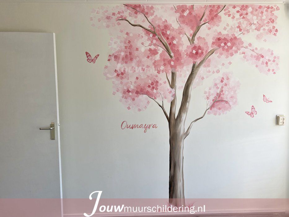 muurschildering bloesem boom roze bloemen op witte muur