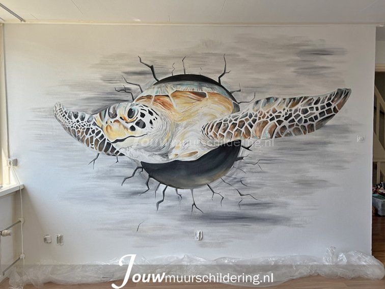 muurschildering graffiti schildpad breekt uit muur