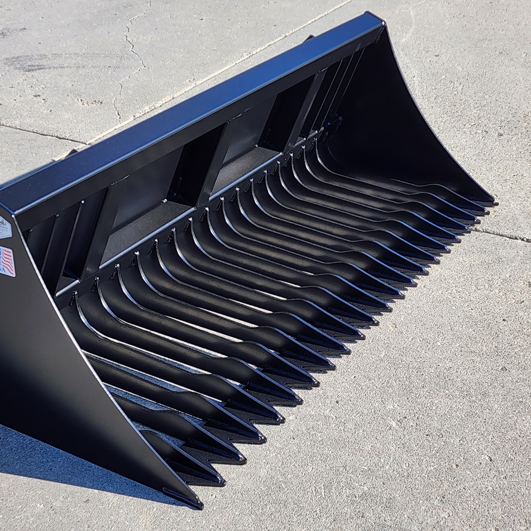 A black bucket with a lot of teeth on it