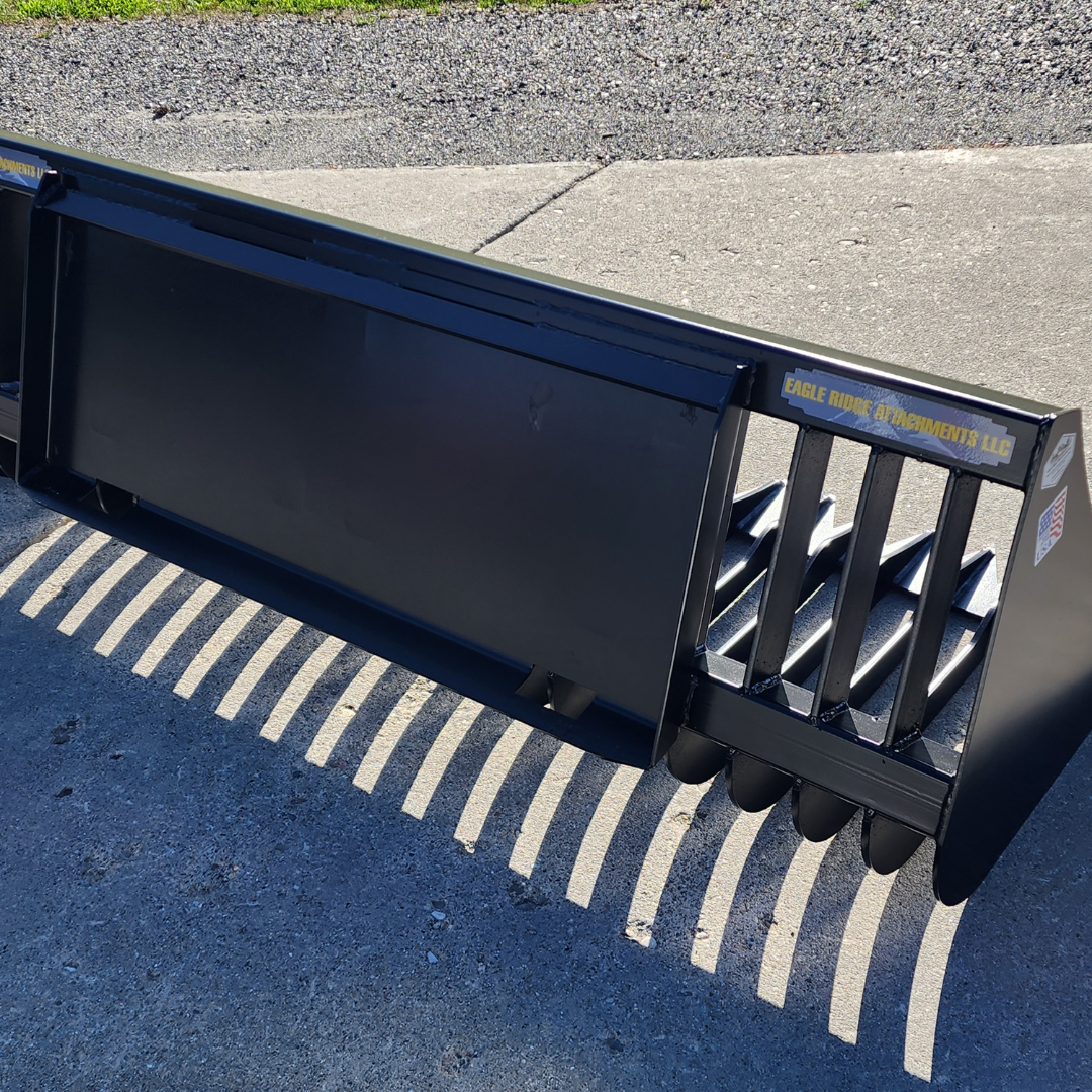 A black bucket is sitting on a concrete surface.