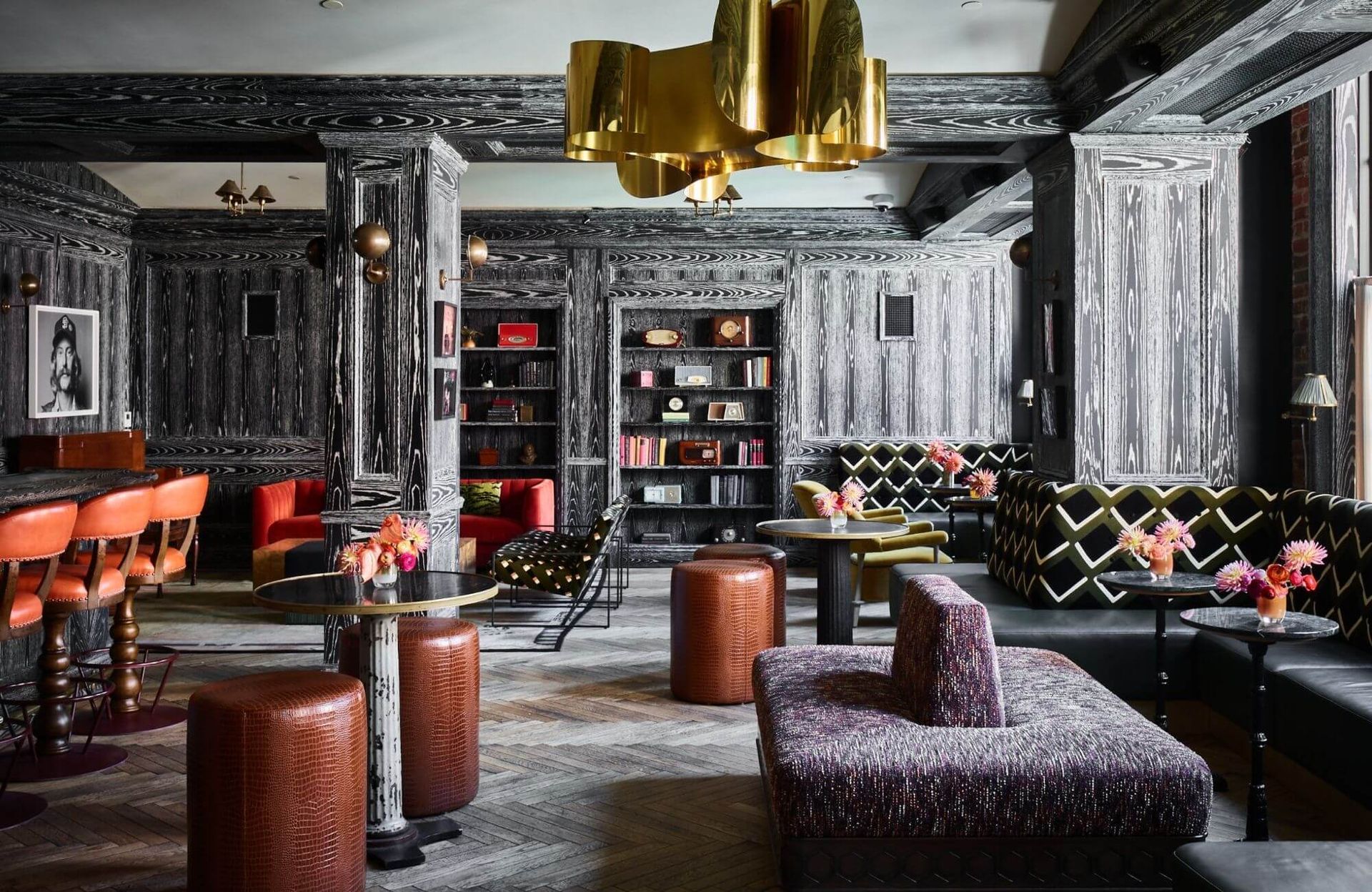 A large room with a lot of furniture and a bar.