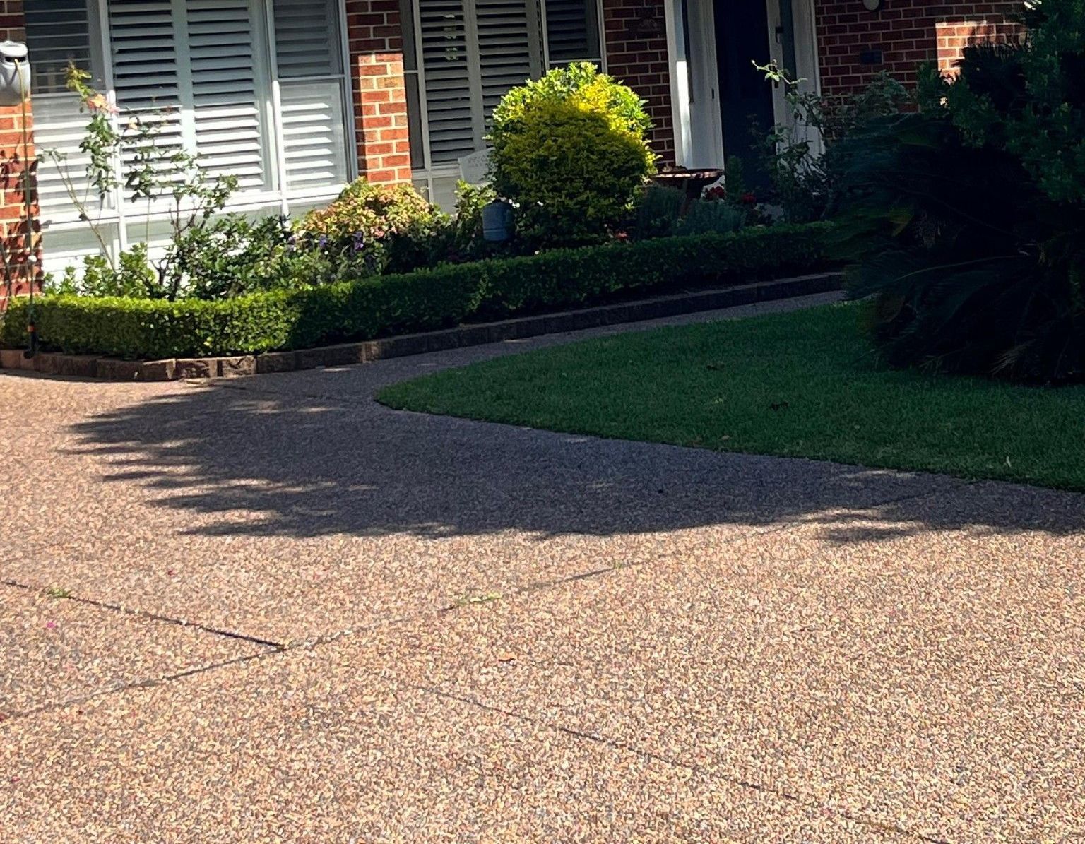 The Roof of a White House With a Blue Sky in the Background — Norwest Roof Restorations In Central Coast, NSW
