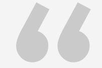 Opening quotation marks, light gray, angled.