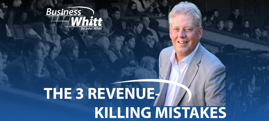 Man in a suit smiles, speaking to a crowd. Headline reads 