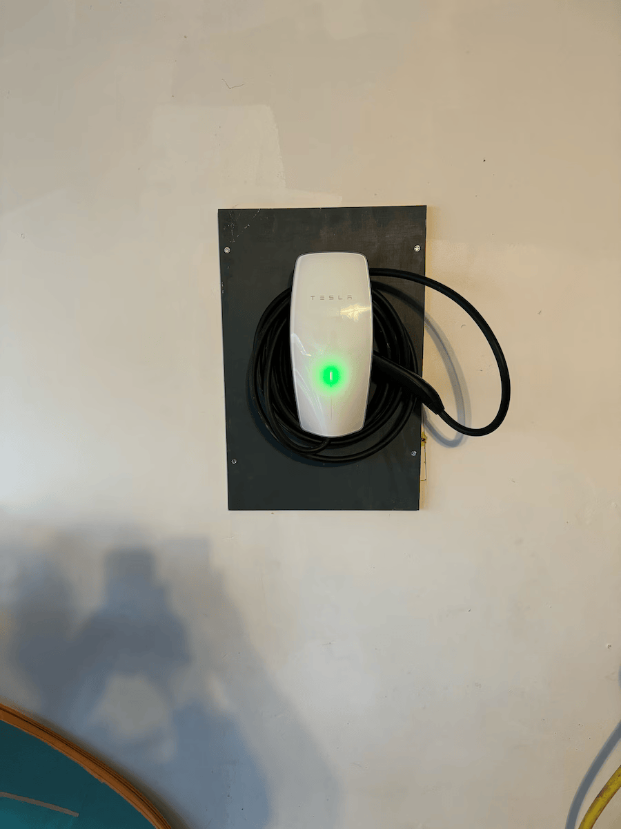 A white device with a green light on it