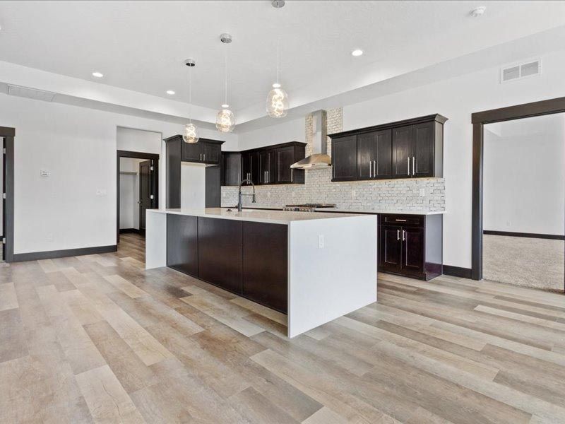 There is a large island in the middle of the kitchen.