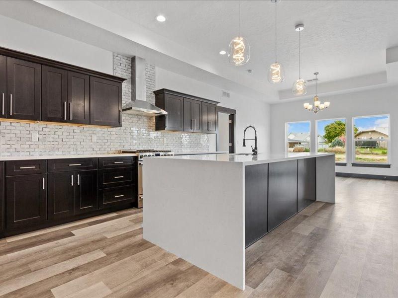 A kitchen with a large island in the middle of the room.