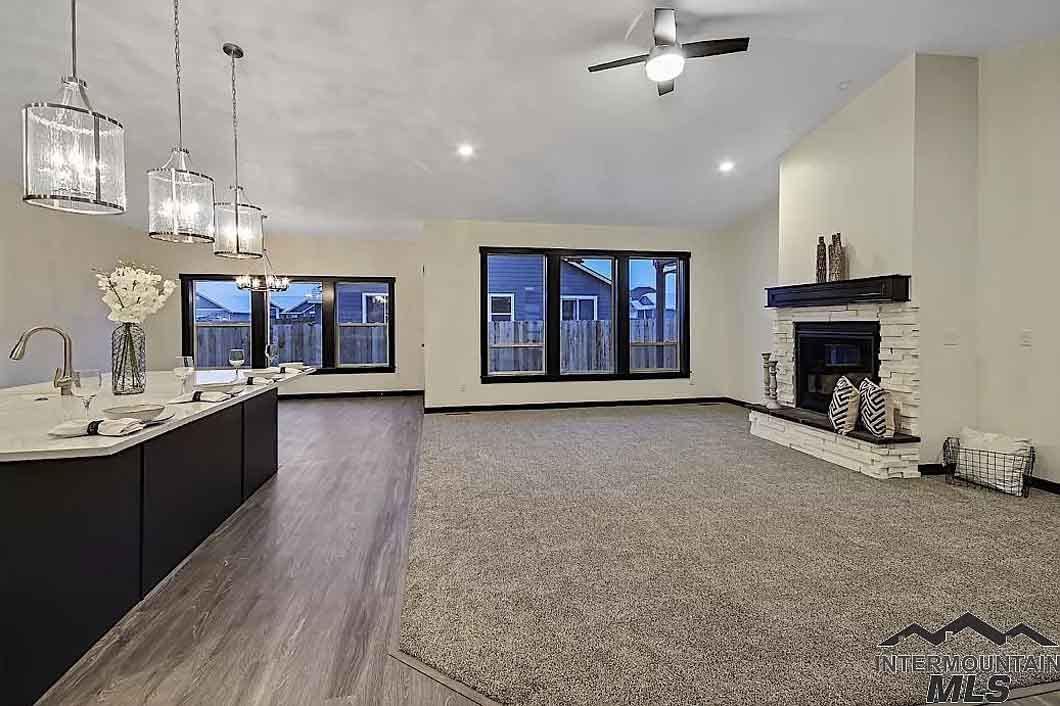 There is a fireplace in the middle of the living room.