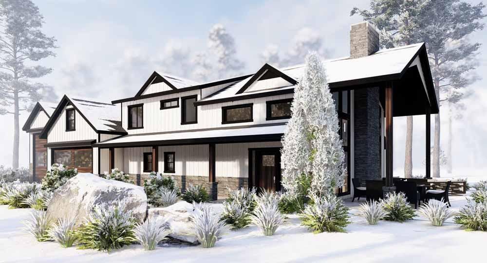 A large house with a porch is surrounded by snow and trees.