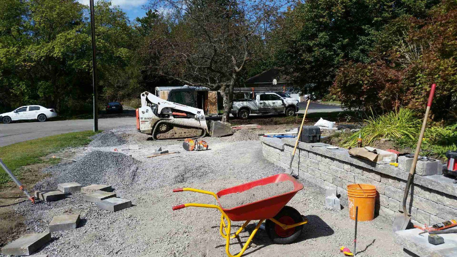 skid steer pushing gravel on construction site