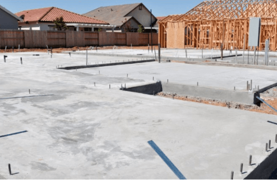 concrete slab foundation with property under construction