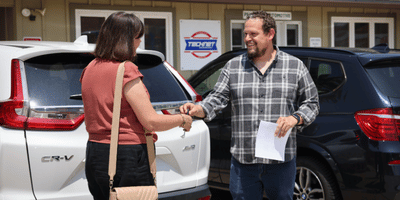Steven, our service advisor giving car keys back to a customer