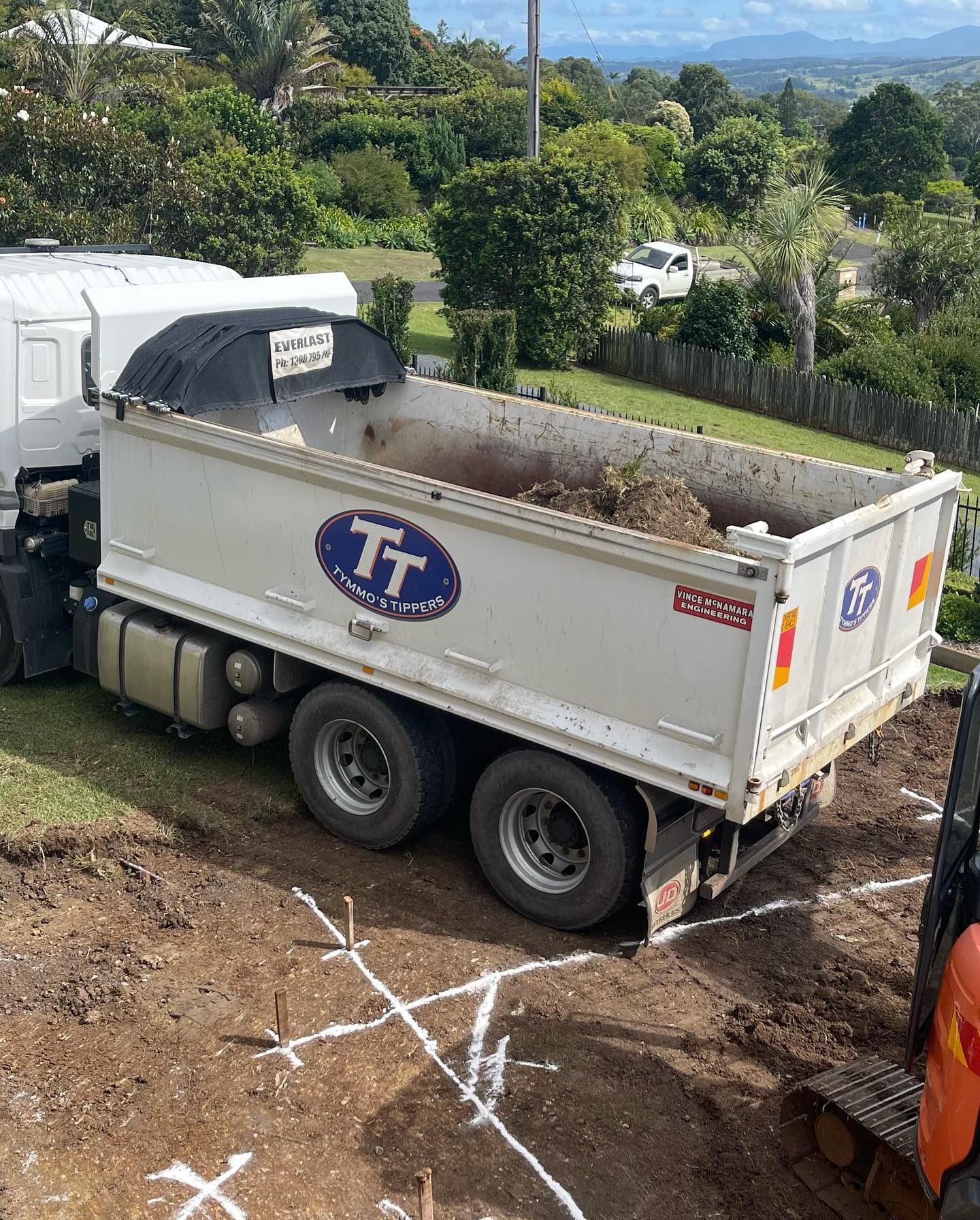 A Dump Truck Is Sitting On Top Of A Dirt Field — Tymmo's Tippers In Evans Head, NSW