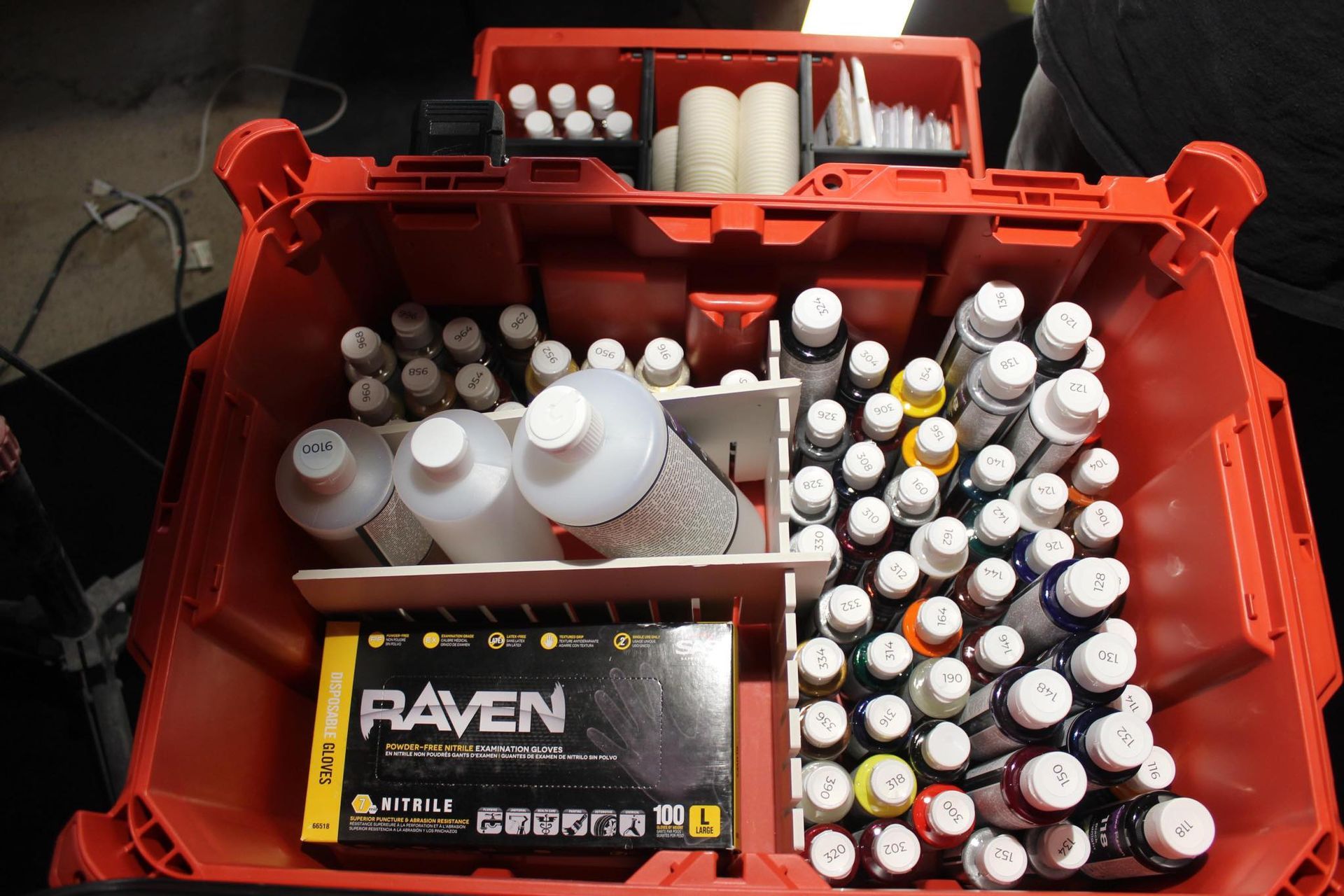 a milwalkee packout box with full paint toner/ color scheme for touch up paint correction kit .