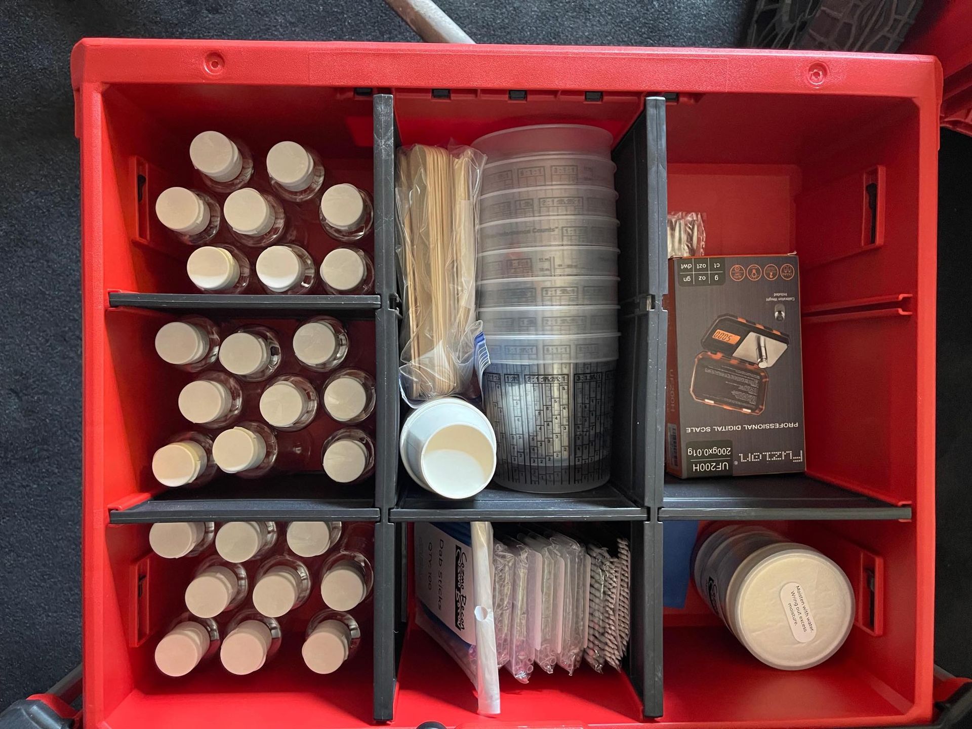 a drawer with all automotive touch up supplies included with the kit .