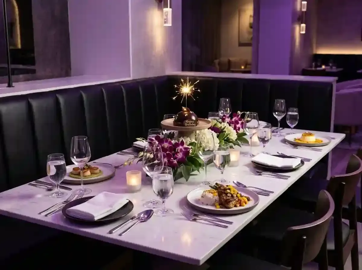 Elegant restaurant table set with flowers, candles, wine glasses
