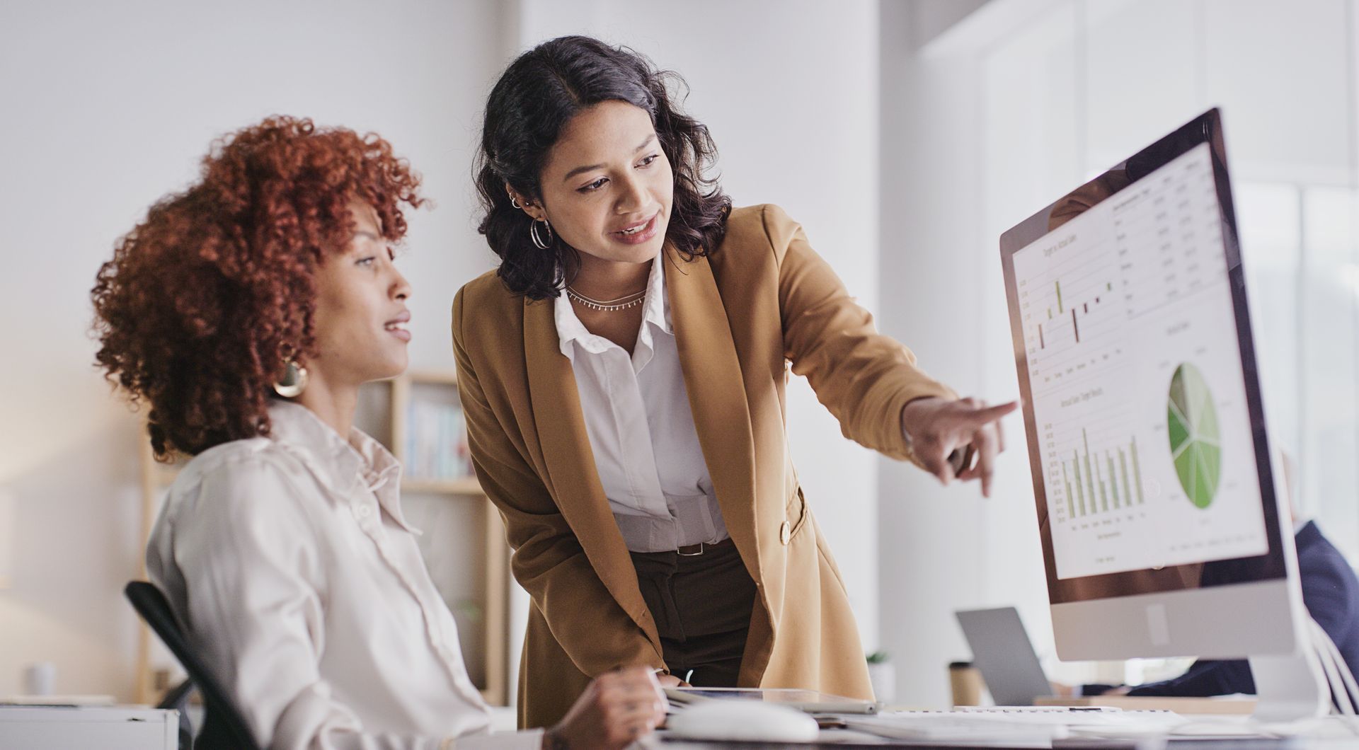 Business professionals analyze corporate data and charts for better management solutions.