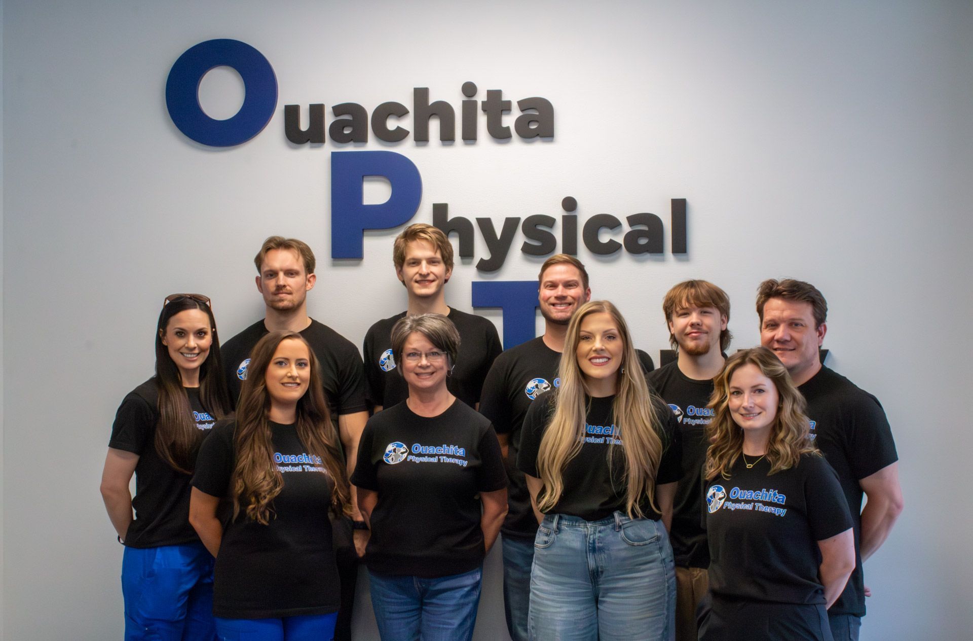 A waiting room with a counter and a door leading to a room.