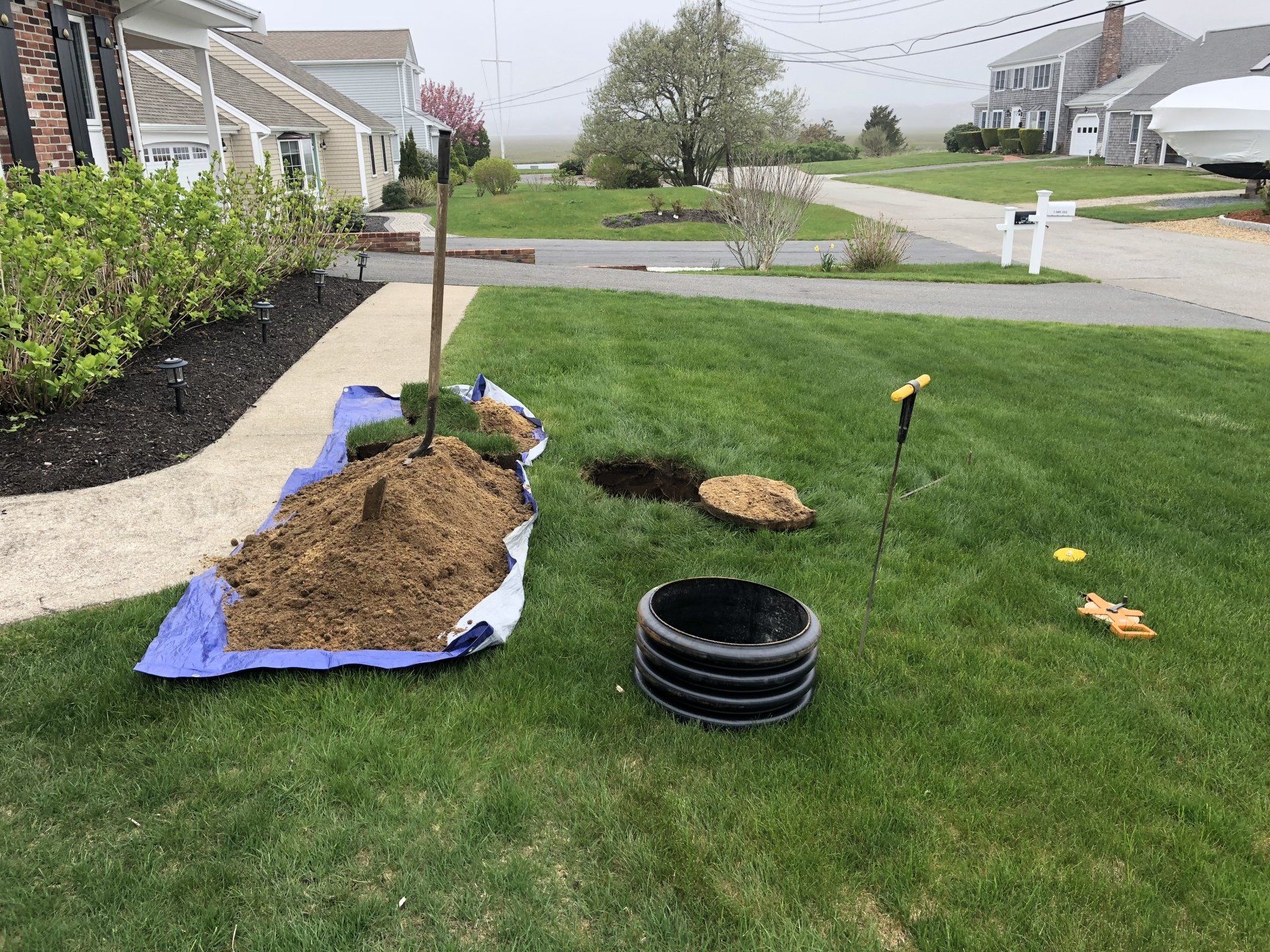 Cape Cod Septic Pumping — Installing Septic tank in the backyard  in Barnstable, MA