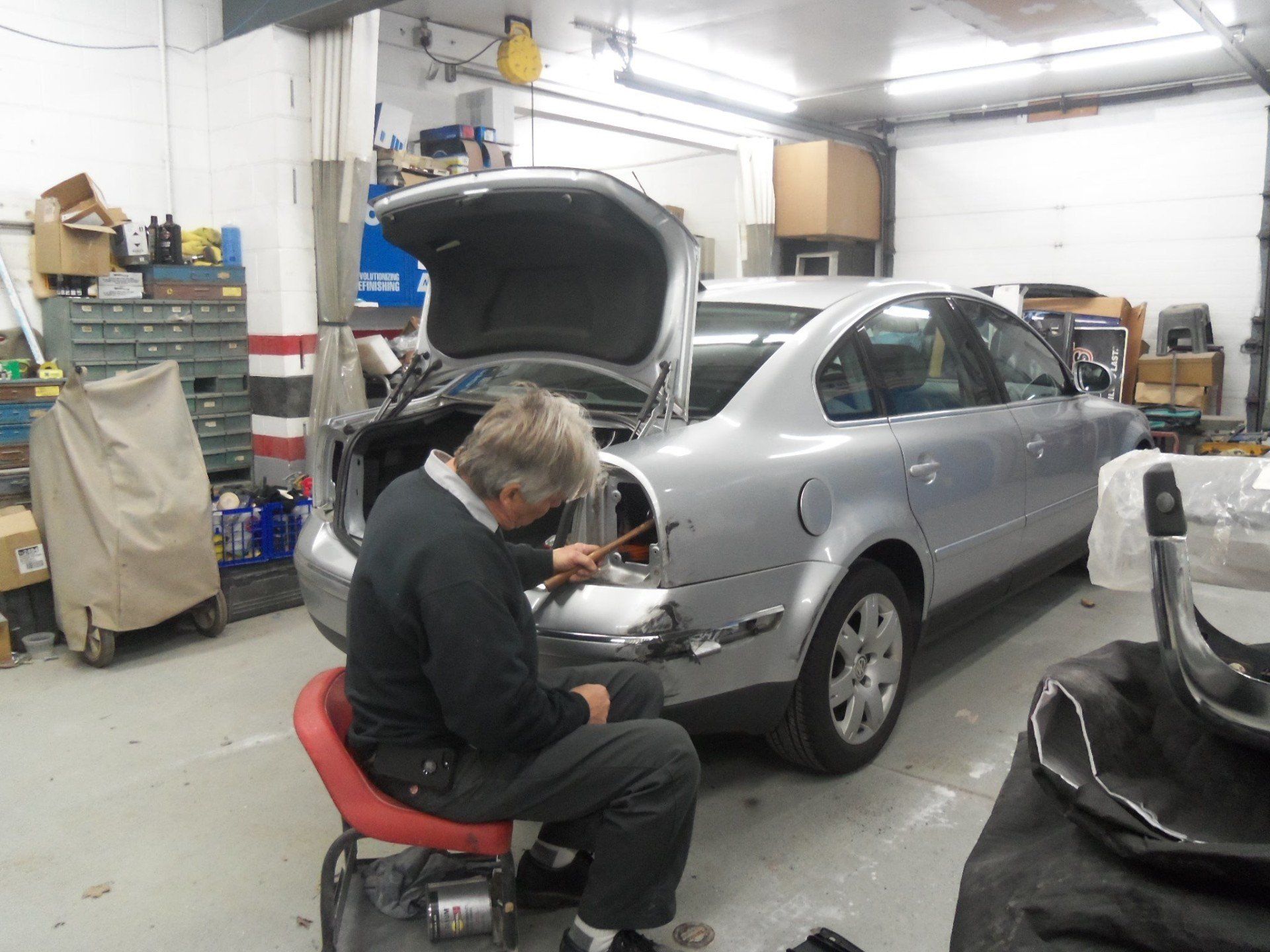 Man Fixing Car Dents — Villas, NJ — John's Auto Body
