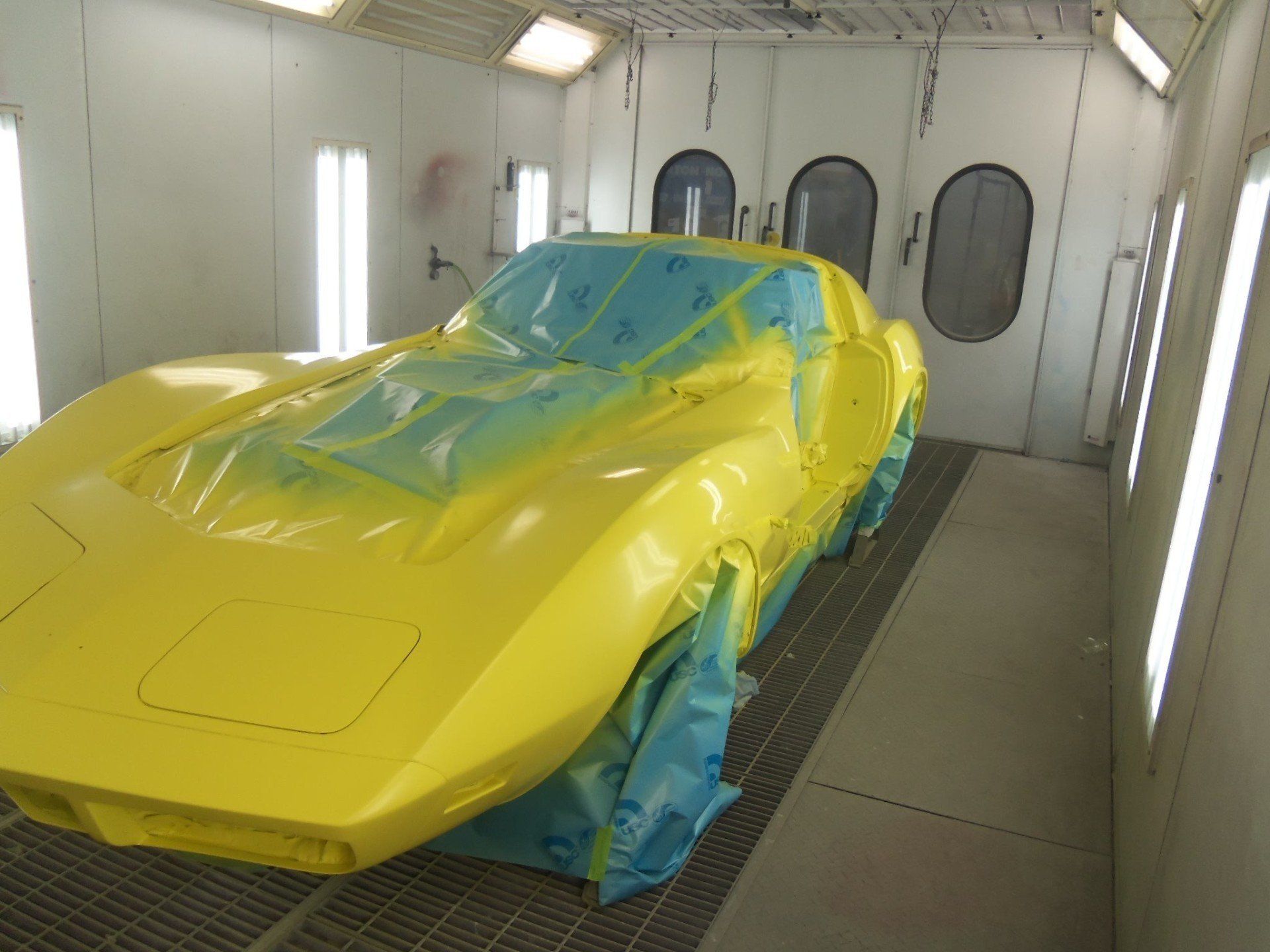 Painting The Car In Yellow Color — Villas, NJ — John's Auto Body