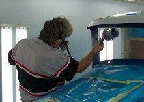Mechanic Spray Painting Vehicle — Villas, NJ — John's Auto Body