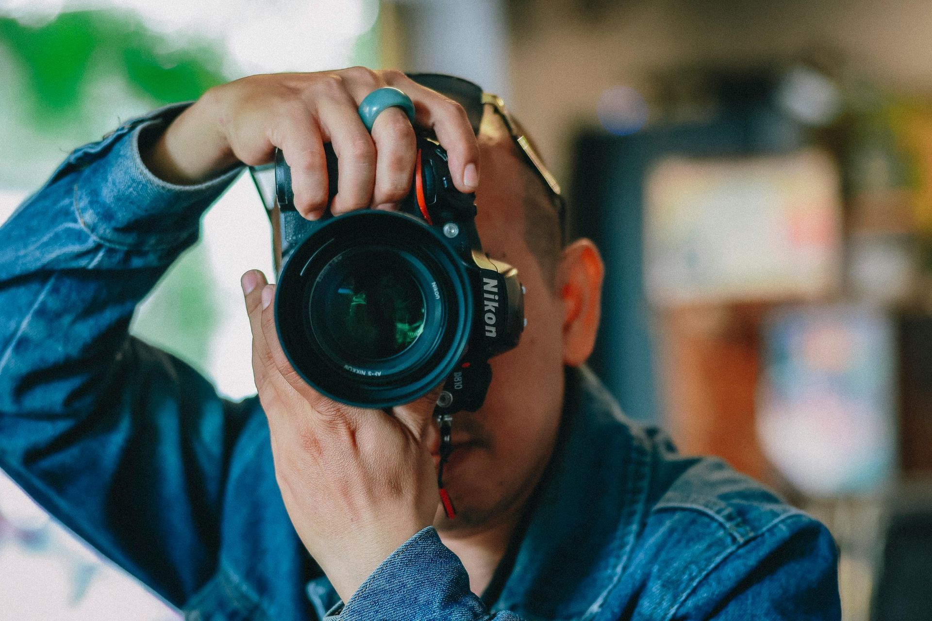 A photographer taking a photo with a professional camera.