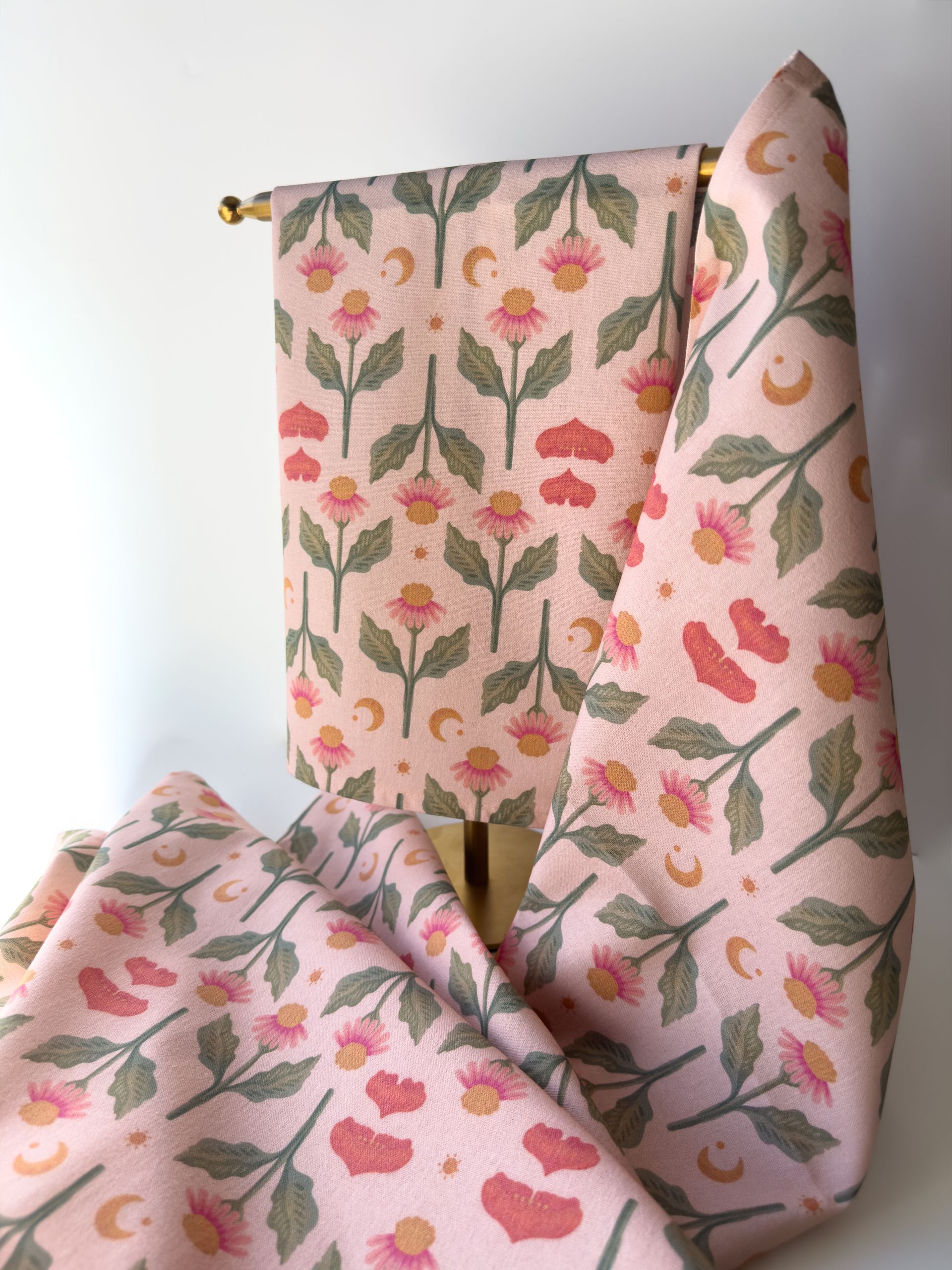 Four bookmarks with flowers and dragonflies on them are sitting on a table.