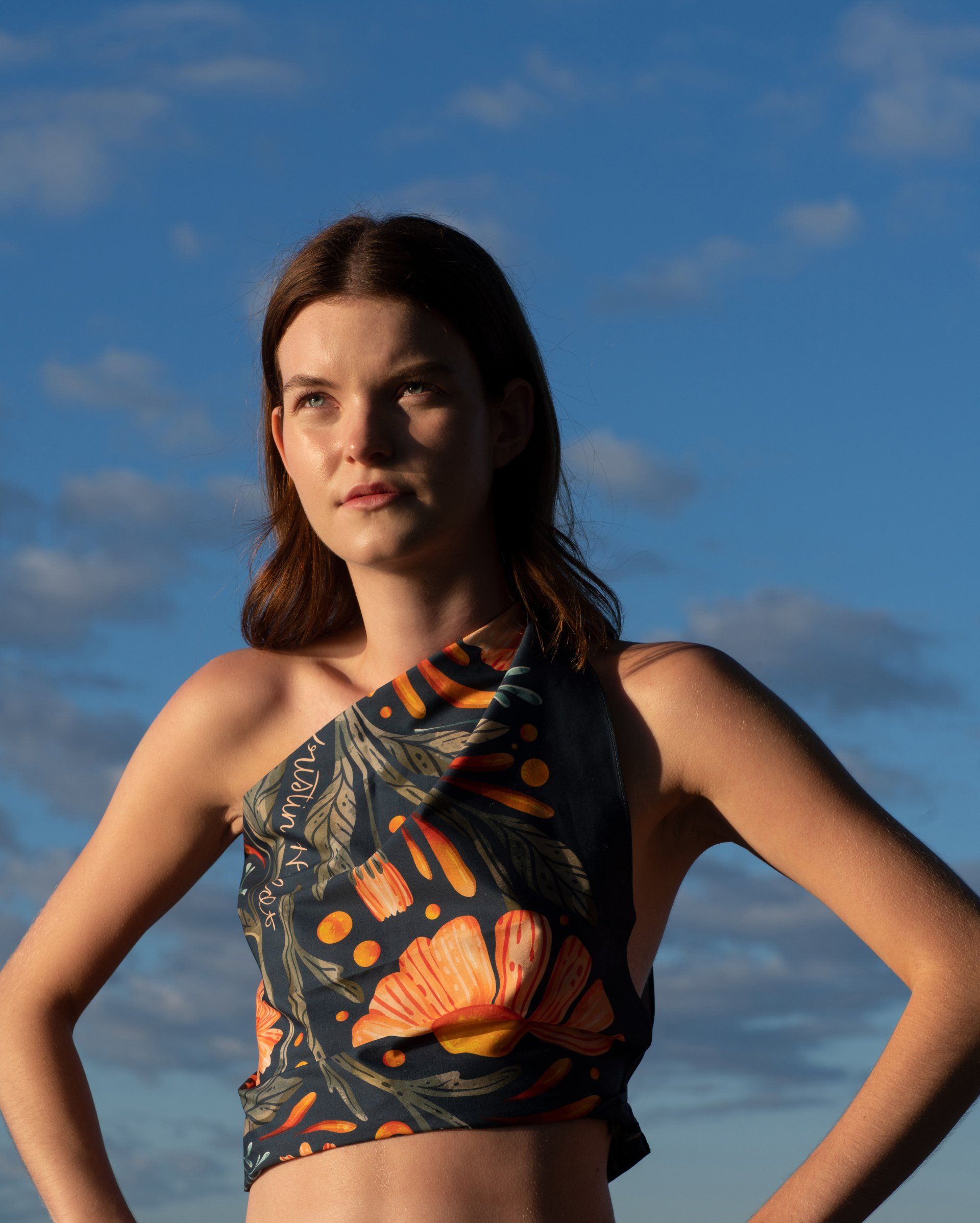 a close up of a painting of flowers on a blue background