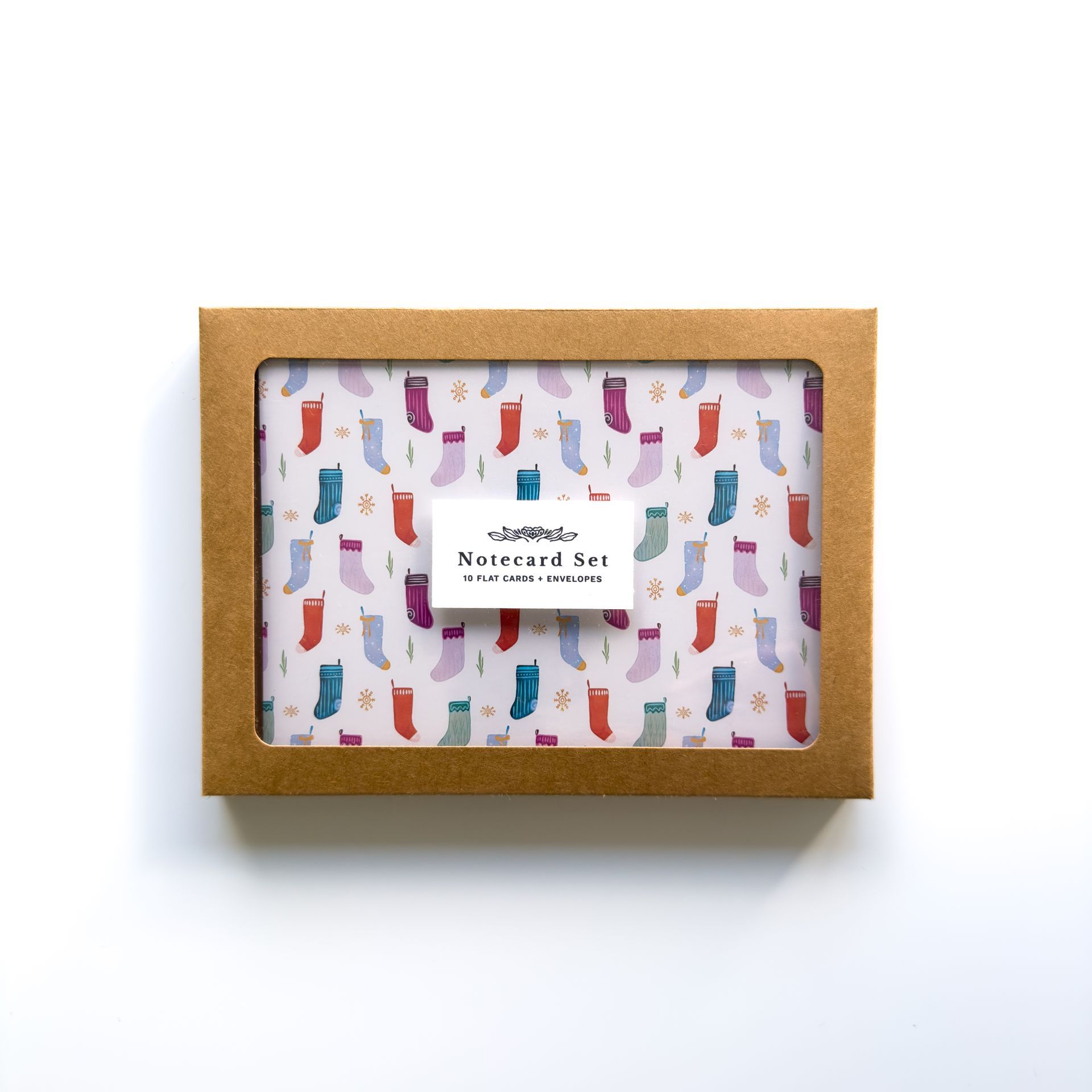 a box of cards and envelopes with a floral pattern on them .