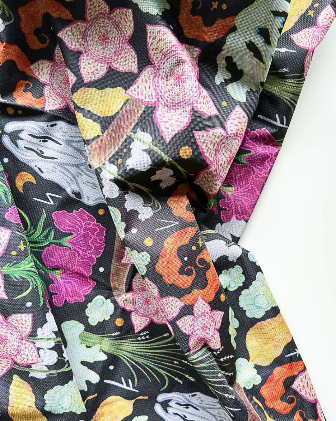 a box of cards and envelopes with a floral pattern on them .